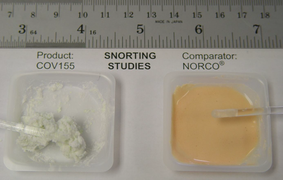 Two small plastic containers one labeled "Product: COV155" and the other labeled "Snorting Studies". On the left side of the image there is a small plastic container with a white substance inside. The container on the right side has a small amount of the same substance but it is a yellowish-orange color. There is also a small spoon in the container which is likely used for snorting the substance. The background is white and there is text on the image that reads "Comparator: Norco".