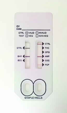 A digital thermometer with two buttons at the bottom. The thermometer is white in color and has a rectangular shape with rounded edges. On the top left corner there is a label that reads "ID/Date" and on the top right corner it reads "CTRL" "VALID" "INVALID" and "NON-NEG". Below the label there are two buttons - CTRL "BAR" "BZO" "COC" and "PCP". <br /><br />The thermometer appears to be used to measure the temperature of a person's body as indicated by the text on the label. The label also has two circular buttons one labeled "Sample Wells" and the other labeled "Test".