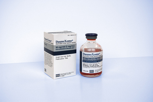 A white box with the brand name "DaunoXome" written on it. Next to the box there is a small glass vial with a black cap. The vial is filled with a red liquid and has a label on it that reads "50 mg/ml". The box is rectangular in shape and appears to be made of cardboard. The background is plain white.