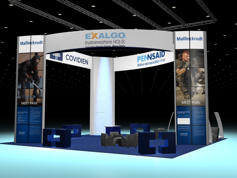 A trade show booth with a blue and white color scheme. The booth has a large banner on the left side with the text "Exalgo" and "Covidien" in bold letters. On the right side there is an image of a man in a military uniform holding a rifle and wearing a helmet. Below the banner there are two smaller banners with the same text and image. The background of the booth is black and there are several blue chairs and tables arranged in front of it. The overall design is modern and professional with a focus on the company's products.