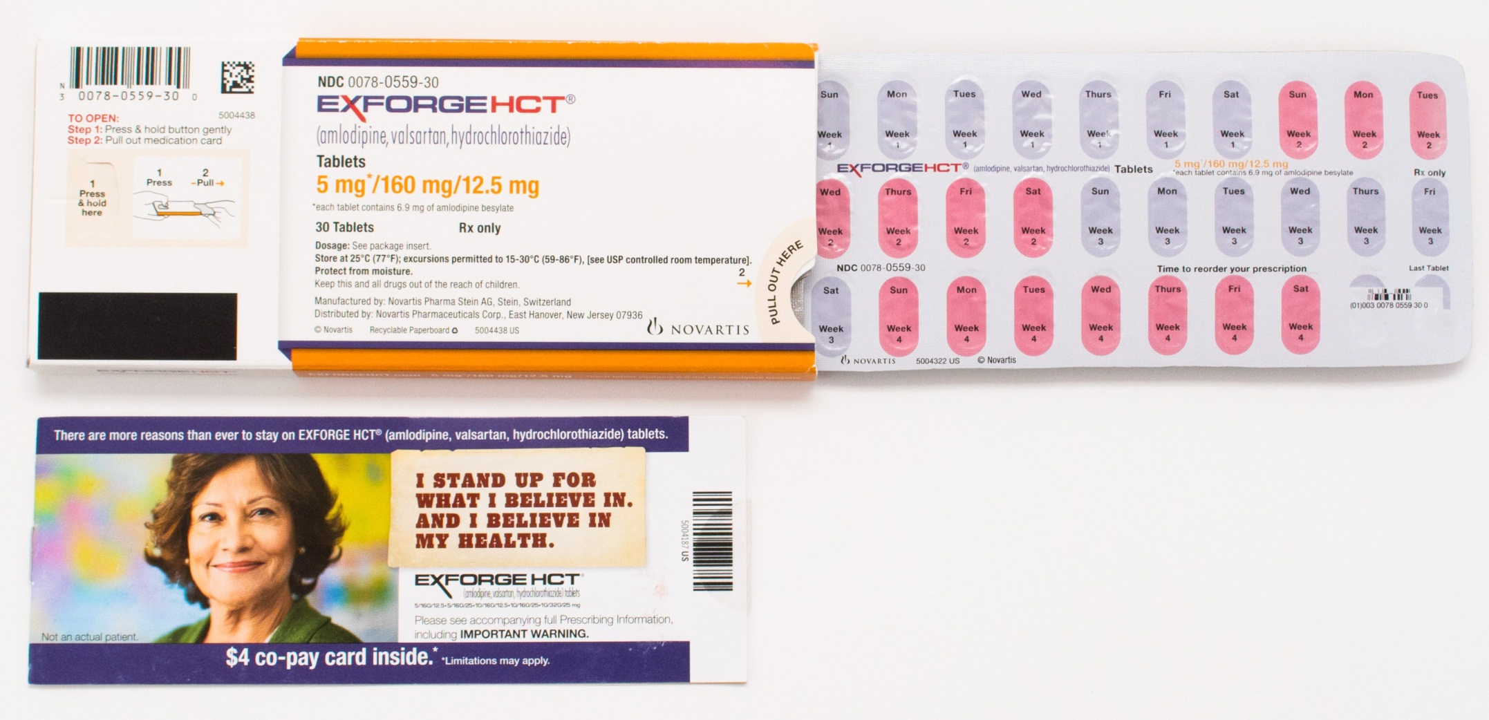 Two pills one in orange and the other in white. The orange pill is labeled "Exforge HCT" and has a barcode on the top left corner. The white pill has a label that reads "5 mg/100 mg/12.5 mg" and "30 tablets". The label also has an image of a woman's face and the text "I stand up for what I believe in my health". There is also a label on the bottom right corner that says "$4 co-pay card inside". The pills appear to be new and unused.