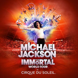 A promotional poster for the Michael Jackson Immortal World Tour at Cirque du Soleil. The background of the poster is a red color with a large image of Michael Jackson in the center. He is wearing a white shirt and black pants and is standing on a stage with his arms stretched out in front of him. The stage is lit up with bright lights and there are several dancers in the background. Above Michael Jackson there is a large explosion of colorful lights that create a sense of energy and excitement. The text on the poster reads "Michael Jackson Immortal" in bold white letters with the words "World Tour" in smaller white letters below it. The words "Cirque du soleil" are written in white letters at the bottom of the image.