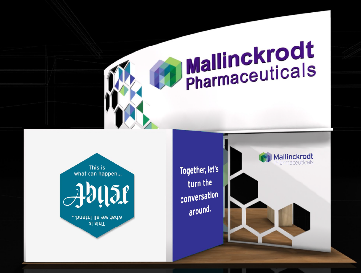 A trade show booth with a white background and a blue and purple logo of Mallinckrodt Pharmaceuticals on the top left corner. The logo is a hexagon with the company's name written in purple and green colors. On the right side of the booth there is a blue banner with the text "Together let's turn the conversation around" written in white. Below the banner there are two smaller banners with the same logo. The booth is set up on a wooden platform with a black background.