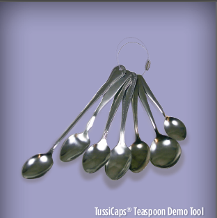 A set of six stainless steel spoons arranged in a line. The spoons are of different sizes and shapes with the largest spoon at the bottom and the smallest at the top. They are all long and slender with a pointed tip and a handle on each spoon. The handles are attached to the spoons with a metal ring which is likely used to hold them in place. The background is a light purple color and there is text on the image that reads "TussiCaps® Teaspoon Demo Tool".