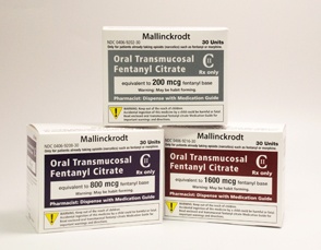 Three white boxes of Mallinckrodt Oral Transmucosal Fentanyl Citrate. The boxes are rectangular in shape and have a yellow and black label on the front. The label has the brand name and product name written in bold black letters. The back of the boxes has a description of the product which states that it is equivalent to 200 mg/ml and is suitable for use with medication. The box on the left has a label that reads "Oral Transmucosal fentanyl citrate" and the box in the middle has the product name "Fentanyl citrate". The box at the bottom has the same label as the one on the right. All three boxes appear to be new and unused.