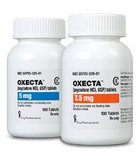 Two white plastic bottles with white caps. The bottles are labeled with the brand name "OXECTA" and the product name "5mg" in bold black letters. The label also mentions that the bottle contains 5mg of the medication which is 7.5mg and that it is 100 tablets. The bottle on the left has a blue label with the same brand name and product name as the one on the right. Both bottles appear to be new and unused. The background is plain white.