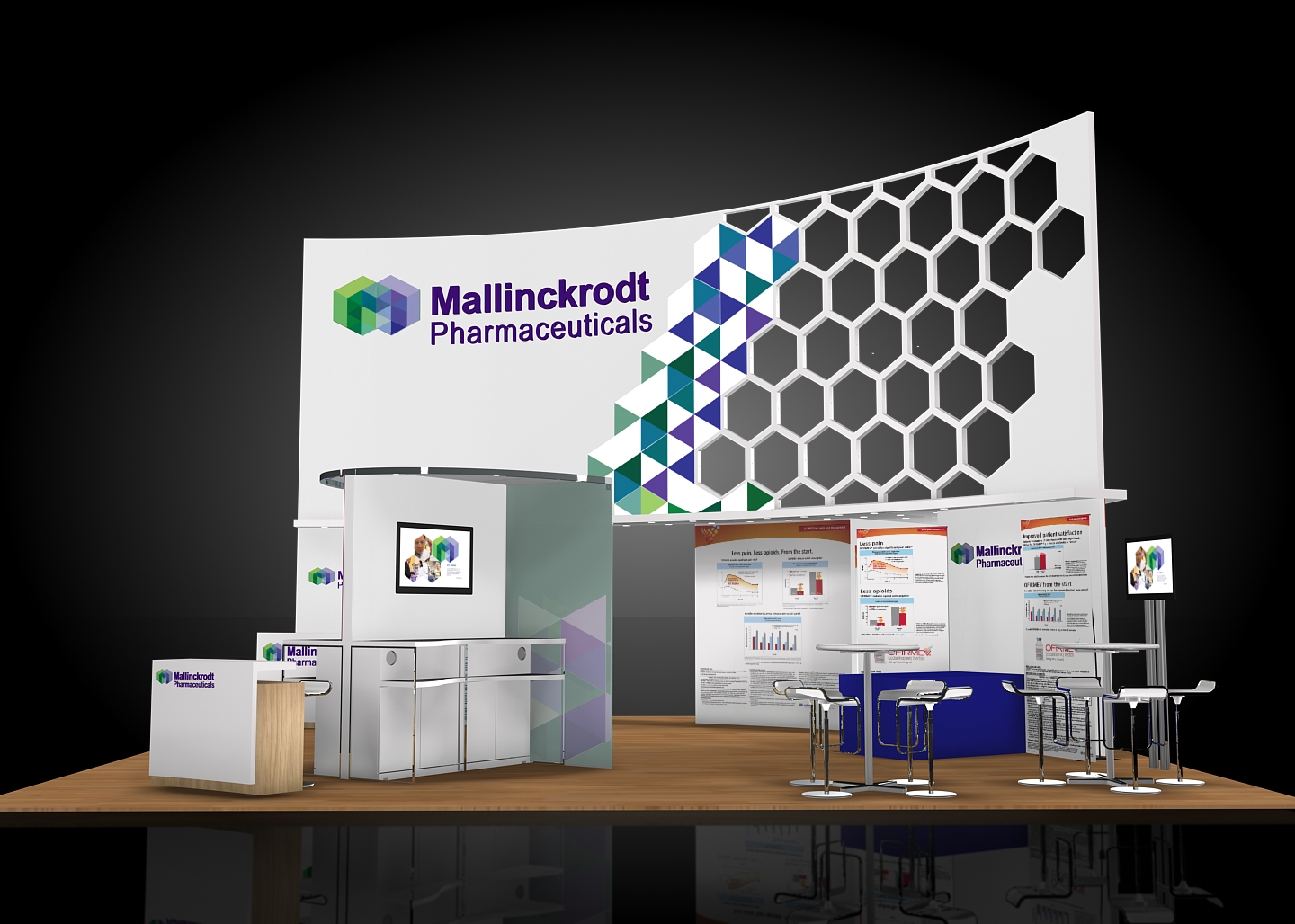 A 3D rendering of a trade show booth for Mallinckrodt Pharmaceuticals. The booth is white with a colorful geometric design on the right side. The design features a hexagonal pattern in shades of blue green and purple. On the left side of the booth there is a large banner with the company's logo and contact information. In front of the banner there are two white booths with a desk and a computer monitor. There are also several bar stools in front of one of the booths. The background is black making the booth stand out.