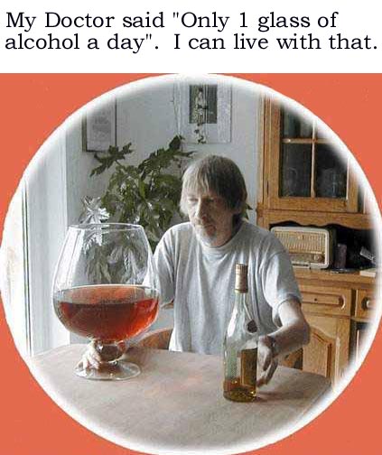 A man sitting at a kitchen table with a glass of alcohol in front of him. He is wearing a white t-shirt and appears to be in his late 60s or early 70s. The glass is filled with a dark red liquid and there is a bottle of alcohol next to it. The man is looking at the glass with a serious expression on his face. The background shows a kitchen with wooden cabinets and a window. The text on the image reads "My Doctor said "Only 1 glass of alcohol a day."