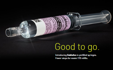 A syringe with a pink label on it. The label has the words "Good to go" written in bold black font. The syringe is made of clear plastic and has a long thin needle at the end. The needle is slightly curved and appears to be filled with a clear liquid. The background is black making the syringe stand out. Below the label there is text that reads "Introducing Gablofen in prefilled syringes. Fewer steps for easier ITB refills."