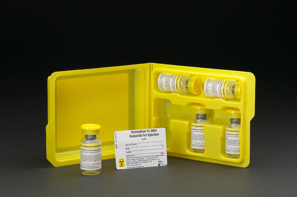 A yellow plastic medicine box with six vials inside. The vials are arranged in a row and each vial has a yellow cap. The box is open revealing the contents inside. There is a small white label on the front of the box with black text that reads "Testimonial for injection". The background is black making the yellow box and vials stand out.