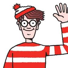 A cartoon illustration of a man wearing a red and white striped shirt and a red beanie with a pom-pom on top. He has a big smile on his face and is waving his right hand in a friendly gesture. His hair is styled in a messy spiky manner and he is wearing glasses. The background is white.