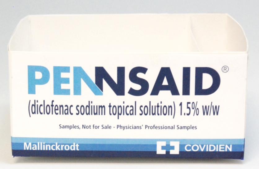 A photograph of a white box with blue and black text on it. The text reads "Pennsaid (diclofenac sodium topical solution) 1.5% w/w" and "Samples Not for Sale - Physicians' Professional Samples". The box appears to be made of cardboard. The brand names "Mallinckrodt" and "COVIDIEN" are written in white text white a blue gradient background at the bottom of the box.