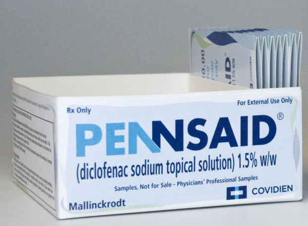 A white box designed to hold samples of Pennsaid (diclofenac sodium topical solution) 1.5% w/w. The background and box are white with text in various shades of blue. The logo of Mallinckrodt and the logo of Covidien are both at the bottom front of the box.