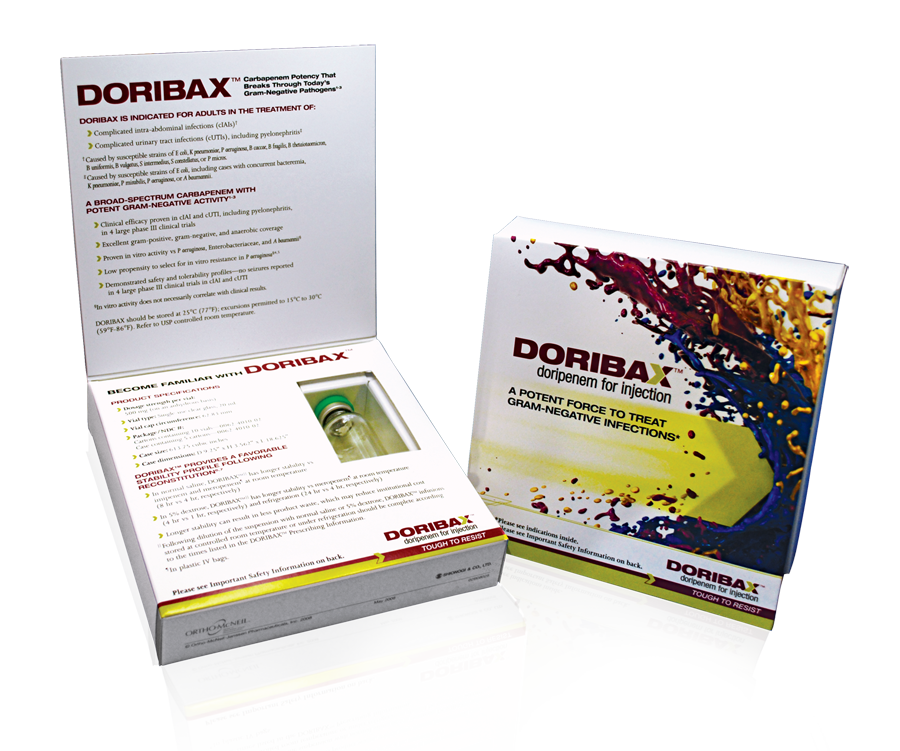 Two boxes of Doribax products. The box on the left is open revealing the contents inside. The top box has a white background with the brand name "DORIBAX" written in bold black letters. Below that there is a description of the product which is written in black text. The bottom box has an image of a bottle of the same product with a red and yellow splatter design on the right side. The text on the top box reads "Doribax" in large bold letters. The image also mentions that the product is made with natural ingredients and is suitable for use in a variety of applications. The boxes appear to be new and unused with no visible damage or wear.