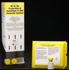 A kit for the preparation of Technetium TC 98m Sestambi injection. The kit is presented in a white box with a black label on the front. The label has the product name and description written in black text. The box is rectangular in shape and has a handle on the top for easy carrying. On the left side of the box there are three yellow capsules which are likely used to administer the injection. <br /><br />Next to the box is a small yellow vial with a yellow cap. The vial is placed on a black surface. The background is also black making the yellow box and vial stand out.