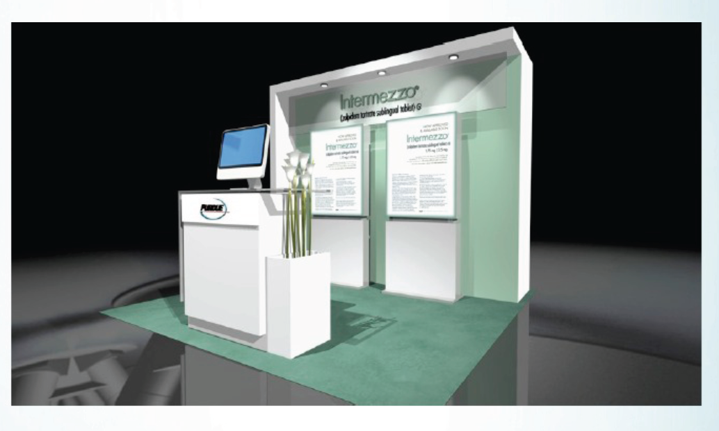 A 3D rendering of a trade show booth. The booth is white with a green countertop. On the left side of the booth there is a desk with a computer monitor and a vase with white flowers. In front of the desk there are two white panels with information about the booth. Above the panels the booth has a sign that reads "Intermezzo" in black letters. The background is black making the booth stand out.