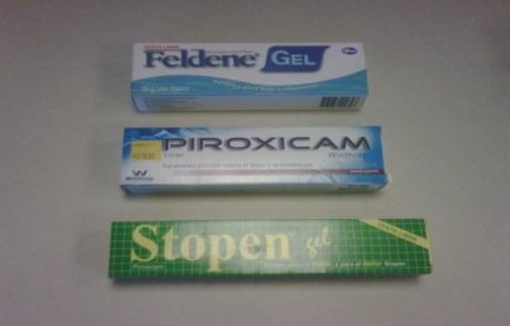 Three different types of gel products. On the top left there is a blue and white box with the brand name "Feldene Gel" written on it. Next to it is a white and blue box with a barcode and the word "Piroxicam" written in bold letters. The box on the top right is also blue and has the brand's logo on it while the box in the middle is white and has a green and yellow label with the words "Stopen gel" in white letters. All three products appear to be new and unused.