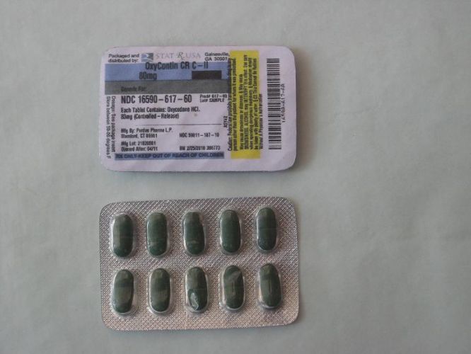 A blister pack of green pills. The blister pack is rectangular in shape and has a white label on the top with black text. The label has a barcode and a yellow barcode on the right side. Below the label there is a description of the pills which reads "NDC 1650-617-60". The pills are oval-shaped and appear to be green in color. The pack is lying on a white surface.