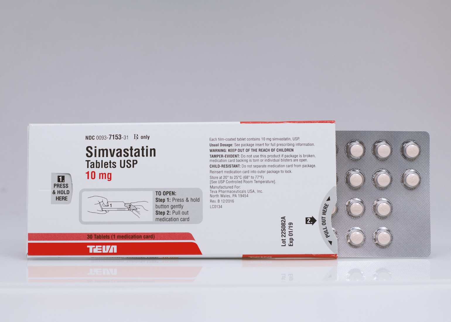 A white and red box of Simvastatin tablets USP 10 mg. The box is rectangular in shape and has a red and white label on the front. The label has the brand name "TEVA" written in bold black letters at the top followed by the product name and dosage information. On the right side of the box there is a blister pack of the tablets. The blister pack is silver in color and has multiple round silver-colored pills inside. The pills are arranged in a grid-like pattern on the blister pack. The background is plain white.