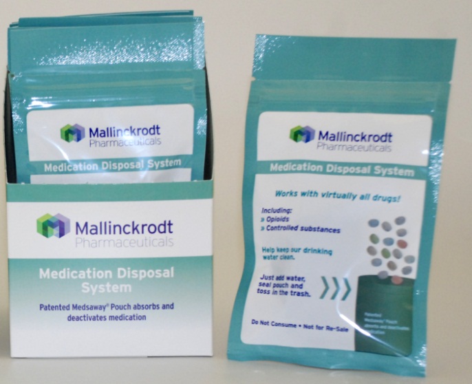 Two packets of Mallinckrodt Pharmaceuticals medication disposal system. The packets are blue in color and have a white label on the front. The label has the company's logo and the words "Medication Disposal System" written in bold black font. On the right side of the label there is a description of the product which states that it works with virtually all drugs and provides instructions on how to use it. The packet on the left has a label that reads "Patented Medicated Pouch absorbs and deactivates medication". The packet in the right has a picture of a pill bottle and the text "Do not consume - Not for sale". Both packets appear to be new and unused.