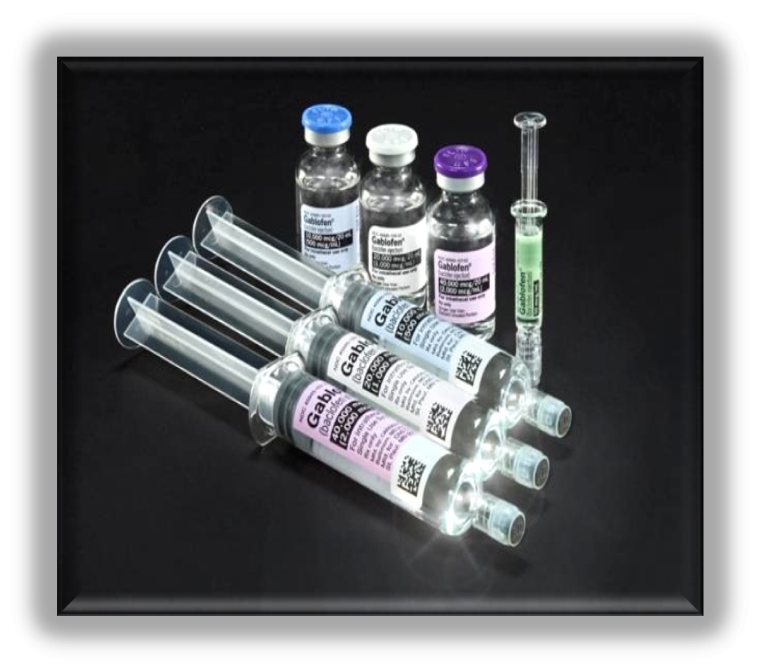 A set of six syringes arranged in a row on a black background. There are six vials of different sizes and colors - one with a blue cap another with a purple cap and the third with a green cap. Each vial has a label on it with a barcode and some text. The vials appear to be filled with a clear liquid possibly a vaccine or a similar substance. There is also a syringe on the right side of the image which is likely used for injecting the vaccine into the vials.