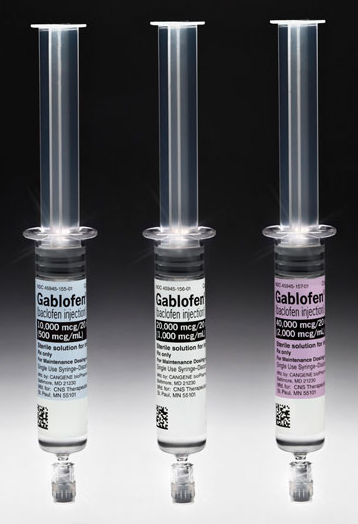 Three syringes of different sizes and shapes. The syringes are made of clear plastic and have a cylindrical shape with a pointed tip. Each syringe has a label on it that reads "Gablofen" in bold black letters. The label also has a QR code on the bottom right corner. The background is black making the syringes stand out.