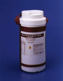 A white cylindrical container with a brown strap around the neck. The container has a white lid and a label on it that reads "Ultra-Technikow OTE". The label also has a yellow symbol and some information about the product. The background is a solid blue color.