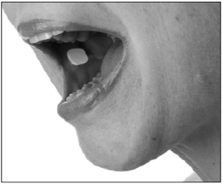 A close-up of a person's mouth showing their teeth. The person appears to be in the middle of a bite with their mouth slightly open and their tongue sticking out. The teeth are white and appear to be slightly crooked. The image is in black and white and the person's face is not visible in the frame. The background is plain white.