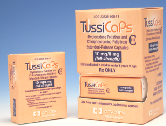 Two orange boxes of TussiCaps a medication used by doctors and medical professionals. The boxes are rectangular in shape and have the brand name "TussiCaps" written in bold white letters on the top left corner. The box on the left is labeled "Hydrocodone Polistrex and Chlorphenamine Polistirex Extended-Release Capsules" and has a label that reads "10 mg/8 mg (full-strength)". The box in the middle has the same label as the one on the right but it has a smaller label that says "Contraindicated in children under 6 years of age. Rx ONLY." The boxes also have the logo of Covidien a pharmaceutical company on the bottom right corner.