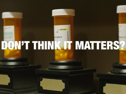 Three orange prescription bottles with white caps on black pedestals. The bottles are arranged in a row and appear to be empty. Each bottle has a label on it with the words "DON'T THINK IT MATTERS?" written in bold white letters. The background is dark making the orange bottles stand out.