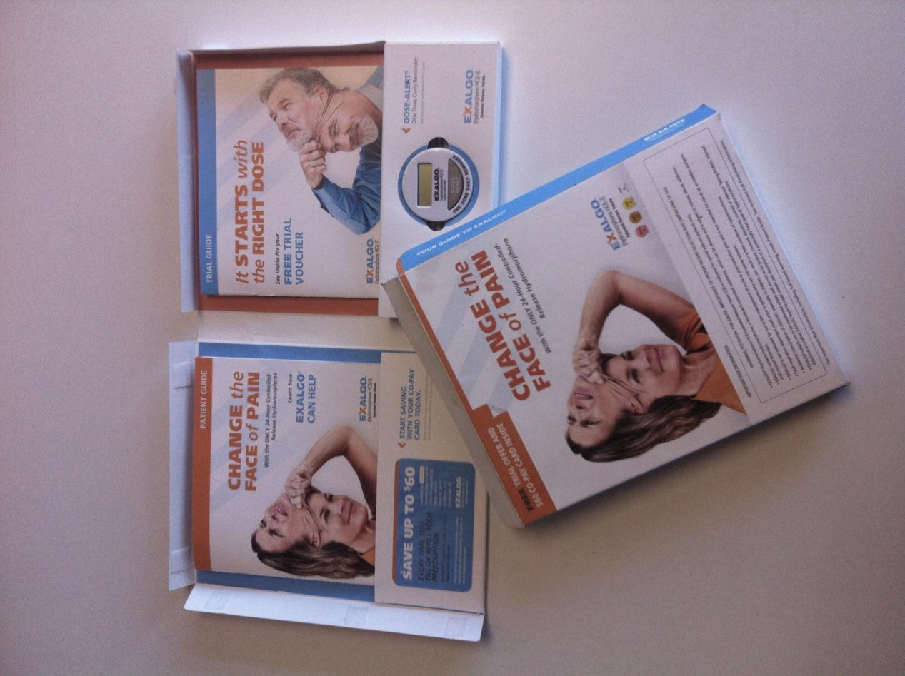 Three brochures lying on a white surface. The brochures are arranged in a triangular formation with the topmost brochure on the left side and the bottom two on the right side. <br /><br />The first brochure has an image of a man and a woman on the cover. The man is wearing a blue shirt and has a serious expression on his face. The woman is lying on her back with her eyes closed and her head resting on her hands. The text on the brochure reads "Change the face of pain". The brochure also has a blue and white logo on the top right corner.<br /><br />There is also a small booklet with a picture of a woman's face on it. The booklet appears to be a guide or brochure for a product called "Change Your Face of Pain".