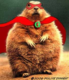 A digital illustration of a groundhog wearing a red cape and a red mask with the letter "G" on it. The groundhog is standing on its hind legs with its front paws stretched out in front of it as if it is ready to take on any challenge. The background is a plain green color and the groundhog appears to be standing on a sandy ground. The image has a playful and whimsical feel to it.