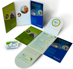 A collection of business cards and stationery items arranged in a flat lay on a white background. There are six cards in total each with a different design and color scheme. <br /><br />The first card on the top left has a green background with a photo of a woman's face and the word "HELP" written in white. The second card has a blue background with images of people and text. The third card has an image of a group of people and the fourth card has text that reads "Help". The fifth card is a white card with a blue and green design and it has a circular logo on the right side. The sixth card is an open book with a green cover and there is a small white card next to it.<br /><br />All the items appear to be new and unused with no visible damage or wear.