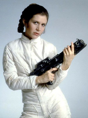 A portrait of Princess Leia from the Star Wars movies holding a large gun. She is wearing a white jumpsuit with a high collar and long sleeves. Her hair is styled in two braids and she is looking directly at the camera with a serious expression. The gun she is holding is black and appears to be a futuristic-looking assault rifle. The background is plain and white making the woman and the gun the focal point of the image.