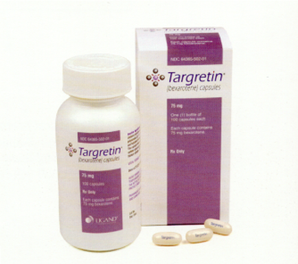 A white bottle with a purple label that reads "targeting" and a white box with the same label. The bottle is cylindrical in shape with a white cap and is placed next to the box. The box is rectangular in shape and has a purple background with white text. On the right side of the box there are several small white pills scattered around the bottle. The pills appear to be capsules of the brand targeting.