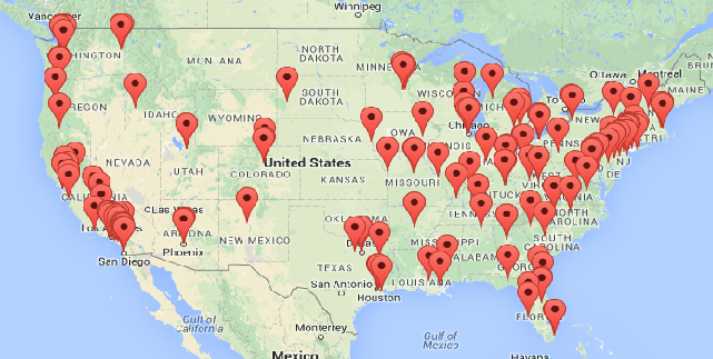 A map of the United States of America with several dozen red pins scattered across the map. The pins are especially concentrated at both coasts and the Midwest. There is no key to indicate what the red pins represent.