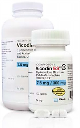 Two white plastic bottles with white caps. The bottle on the left is labeled "Vicodin ES" and has a label that reads "7.5 mg/300 mg". The label also mentions that the bottle contains 100 tablets. The background is plain white.