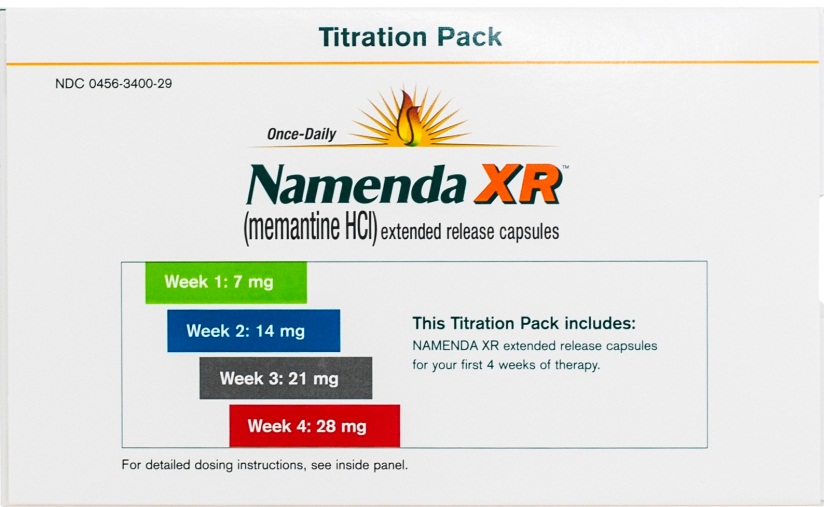 A product packaging of Namenda XR (Mementine HC) extended release capsules. The packaging is white with a yellow and orange logo on the top left corner. The logo is a sun with rays of light radiating outwards. Below the logo there is text that reads "Once-Daily Namenda XR" in bold black letters. <br /><br />On the right side of the packaging there are two tabs - Week 1: 7 mg and Week 2: 14 mg. The tabs are labeled "Week 3: 21 mg" and "Week 4: 28 mg". Below the tabs it says "This Titration Pack includes: NAMENDA XR extended release capsule for your first 4 weeks of therapy."<br /><br />The packaging also has a description of the product which states that it is for detailed dosage instructions see inside panel.