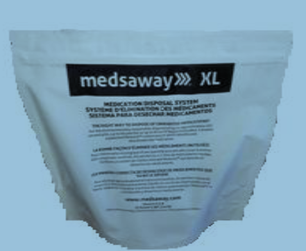 Of a white plastic bag with a black label on it. The label reads "meds away XL" in bold black letters. Below the label there is a description of the product which states that it is a medication disposal system. The bag appears to be sealed and is standing upright on a blue background.