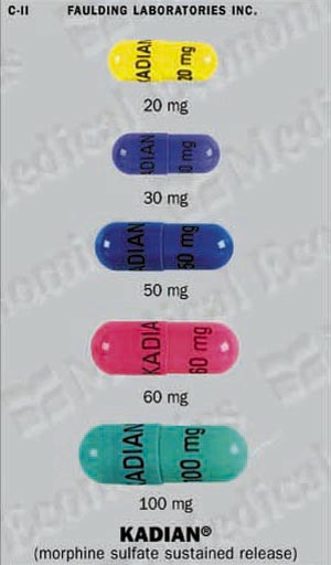 Six capsules of Kadian a morphine sulfate sustained release medication. The capsules are arranged in a row with each capsule having a different color - yellow blue pink green and purple. The yellow capsule has the word "KADIAN" written on it in black letters while the blue capsule has "20 mg" written in white letters. The pink capsule has a label that reads "30 mg" and "50 mg". The green capsule has an "60 mg" label and the purple capsule has two "100 mg" labels. The background of the image is white and there is a label on the top left corner that says "Faulding Laboratories Inc."