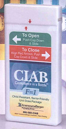 Of a white plastic bottle with a label on it. The label has a blue background with white text that reads "CLAB Compliance in a Bottle F-1 Child-Resistant Senior-Friendly Unit Dose Package". Below the text there is a red arrow pointing to the right and a green arrow pointing towards the left. The text on the label reads "To Open Push Cap Down & Slide". The label also mentions that the product is designed to align red arrows push cap down and slide. The bottle appears to be new and unused.