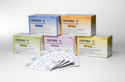 A group of five boxes of mentor tablets. The boxes are arranged in a pyramid-like formation with the top box being the largest and the bottom two boxes being the smallest. Each box has a different color and label on it. The first box is blue the second box is yellow the third box is pink the fourth box is orange the fifth box is green the sixth box is purple and the seventh box is white. The labels on the boxes read "mentor" and "100 mg/ml". In front of the boxes there are a few small packets of the tablets scattered around. The packets appear to be white with black text. The background is plain white.