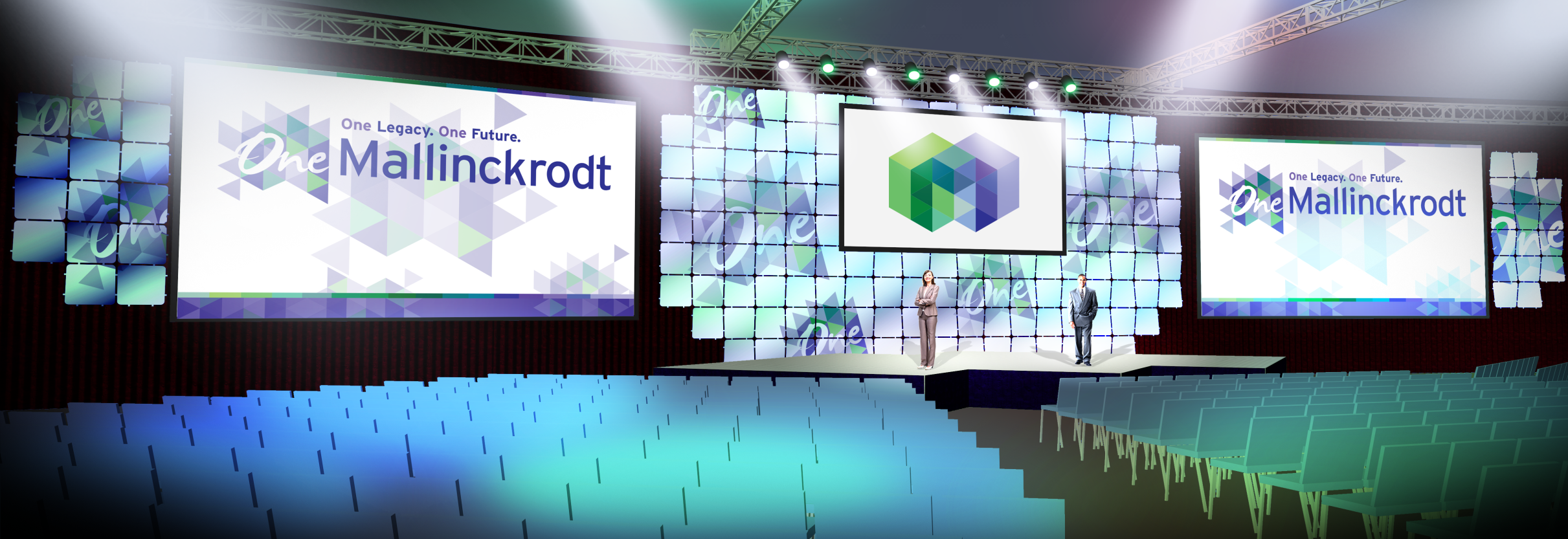 A stage set up for a conference or event. The stage is decorated with a large screen in the center that reads "One Mallinckrodt" in white text. On either side of the screen there are two smaller screens with the same text. The background of the stage is made up of blue and green geometric shapes creating a modern and futuristic look. The floor is covered in rows of blue chairs and there are rows of empty seats on the right side. The overall color scheme of the image is blue green and white.