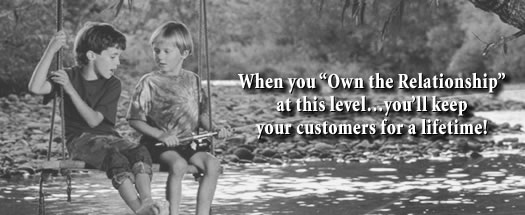 A black and white photograph of two young boys sitting on a swing in a park. The boy on the left is wearing a t-shirt and shorts and is holding onto the swing with both hands while the boy in the middle is holding a fishing rod. They are both looking at each other and appear to be engaged in a conversation. The background is blurred but it appears to be a wooded area with trees and bushes. The text on the image reads "When you "Own the Relationship" at this level...you'll keep your customers for a lifetime!"