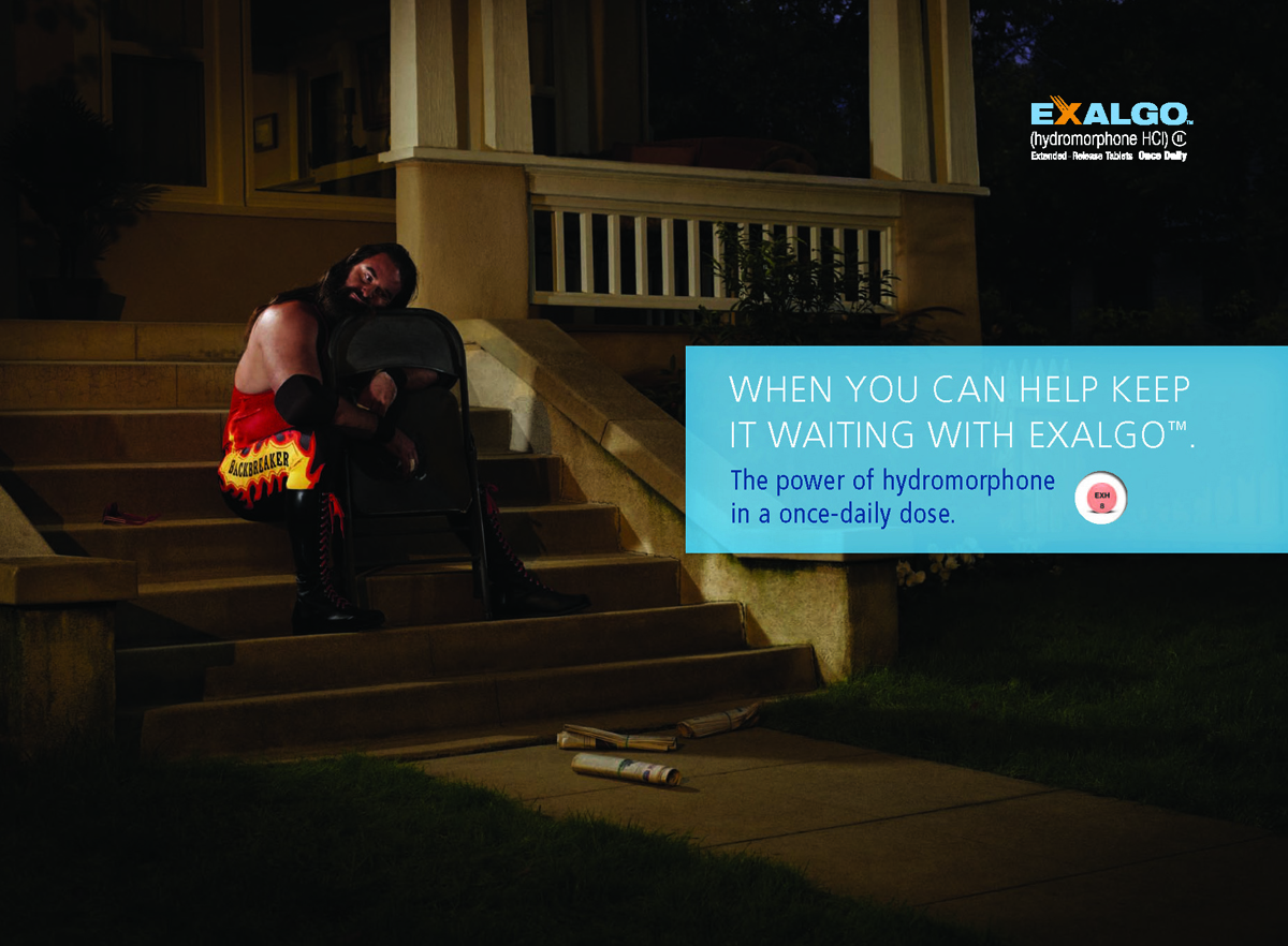 A wrestler sitting on the steps of a house at night. He is wearing a red and yellow outfit with the word "EXALGO" written on it. He has long dark hair and is holding a black folding chair in his hands. The man appears to be deep in thought with his eyes closed and his head resting on the chair. The house is lit up with a warm glow and there are a few items scattered on the ground in front of him. The text on the image reads "When you can help keep it waiting with EXALGO. The power of hydromorphone in a once-daily dose."