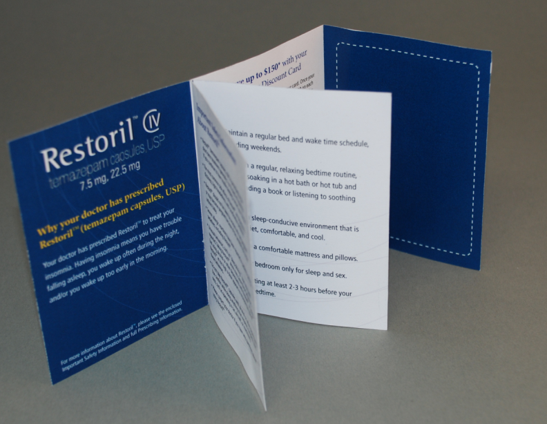 A blue and white brochure with the text "Restoril IV" on the left side. The brochure is open revealing the contents inside. On the right side of the brochure there is a white card with the same text. The text on the card is written in black font and is divided into two sections. The left section has a blue background with white text and a white border. The card appears to be a brochure for a product called Restoril as indicated by the text.<br /><br />The card is folded in half with the top half open and the bottom half closed. The top half of the card has a white background with a blue border. There is also a small illustration of a pill bottle on the bottom right corner. The illustration is of a bed with a white pillow and a blue blanket. The pill bottle is labeled with the product name and a description of its benefits.