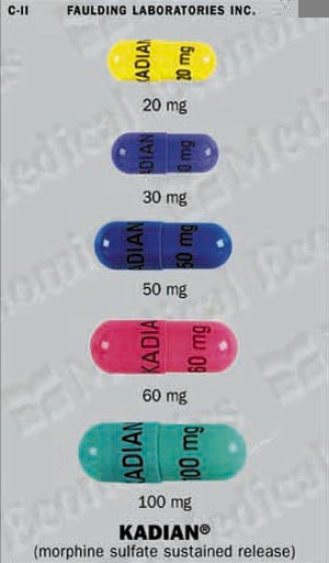 Six capsules of Kadian a type of morphine sulfate sustained release. The capsules are arranged in a row with each capsule having a different color - yellow blue pink green and purple. The yellow capsule has the word "KADIAN" written on it in black letters while the blue capsule has "20 mg" written in white letters. The pink capsule has a label that reads "30 mg" and "50 mg". The green capsule has an "60 mg" label and the purple capsule has two "100 mg" labels. The background of the image is white and there is a label on the top right corner that says "Faulding Laboratories Inc."