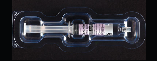 A transparent plastic syringe with a long cylindrical body and a narrow neck. The syringe is placed in a clear plastic case with a black background. The case appears to be made of a transparent material allowing the syringe to be seen through it. On the side of the case there is a label with the brand name "Gabrielle" written in white text. The label also has a barcode and other information about the product.