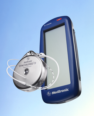 A blue-colored electronic device which appears to be a medical device with the brand name "Medtronic" written on the front. The device has a large screen on the right side and a small speaker on the left side. The speaker is connected to the device with a white cable. The background is a light blue color and the device is placed on a flat surface. The image is a 3D rendering giving it a realistic look and feel.