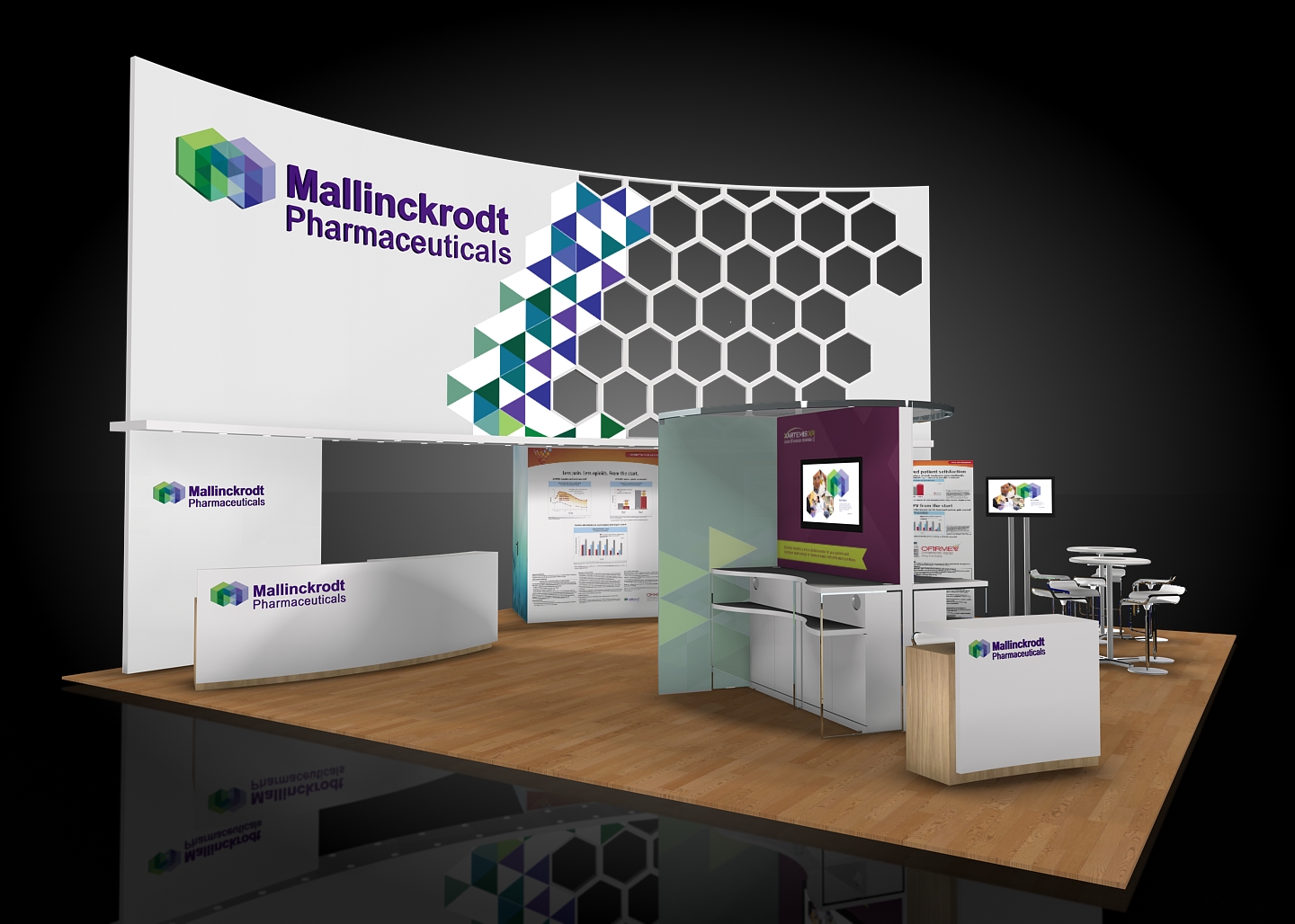 A 3D rendering of a trade show booth for Mallinckrodt Pharmaceuticals. The booth is white with a colorful geometric design on the left side and a large banner on the right side. The banner has the company's logo and name in bold colorful letters. <br /><br />In front of the booth there is a desk with a computer monitor and a few chairs. On the desk there are two banners with information about the company. The background is black and the booth is set up on a wooden floor. The overall design is modern and professional with a focus on the company and its products.